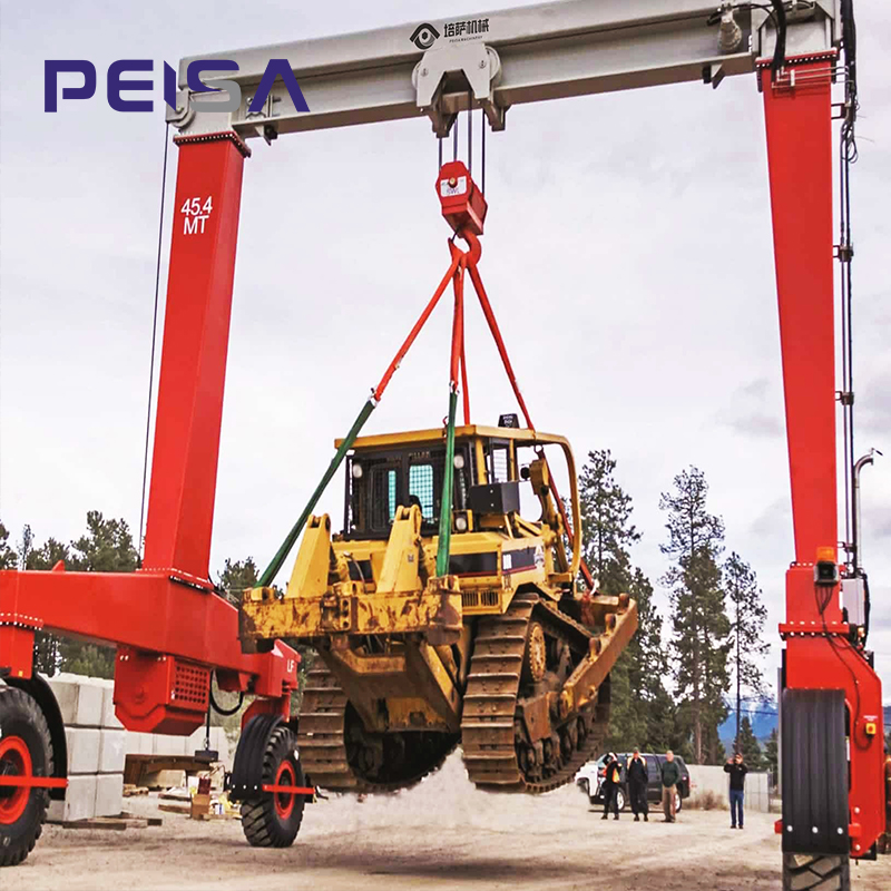A Rubber Tire Crane is a hybrid lifting system that combines the structural advantages of a traditional gantry crane with the mobility of rubber wheels. It is also commonly referred to as a Rubber-Tired Gantry Crane.